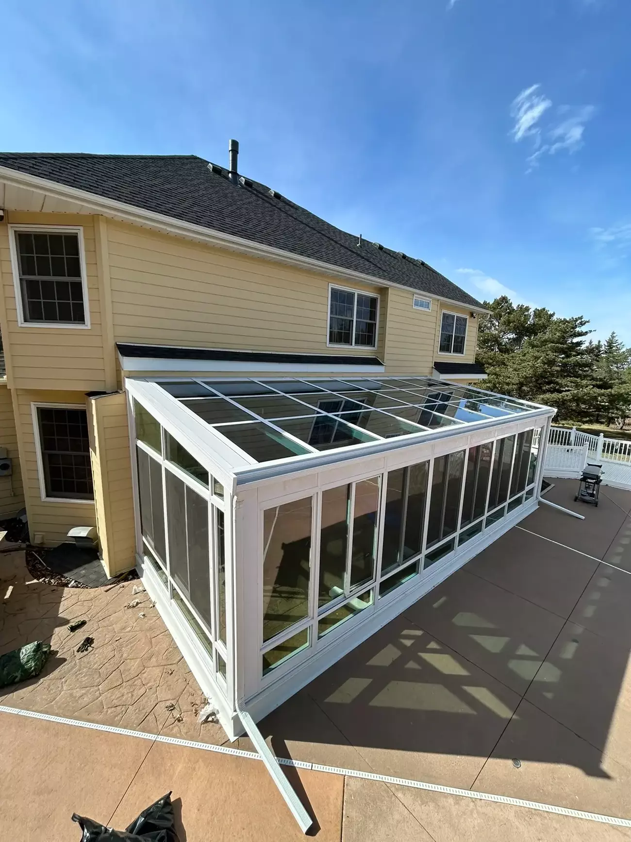 Beautiful sunroom addition in Apple Valley home with natural light and garden views